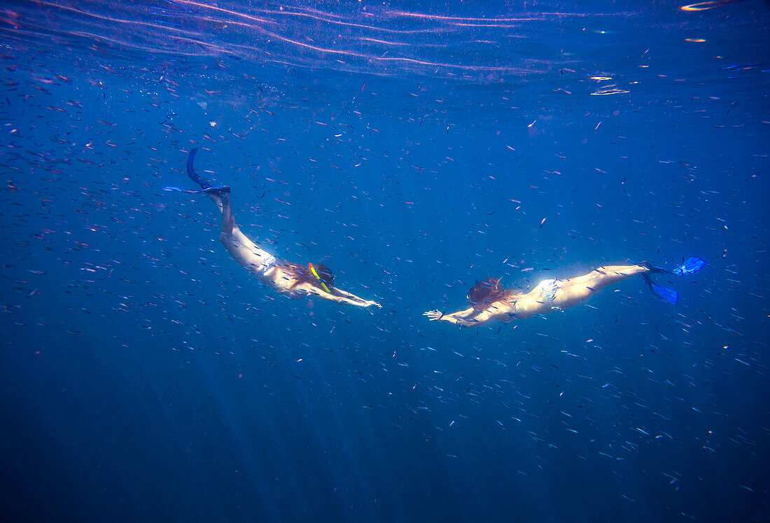 Two Young Woman Snorkeling in Ocean.