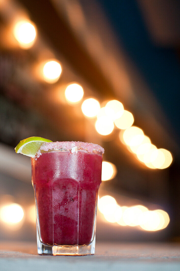 Pomegranate Martini with lime garnish at East Ender restaurant on Middle Street in Portland Maine