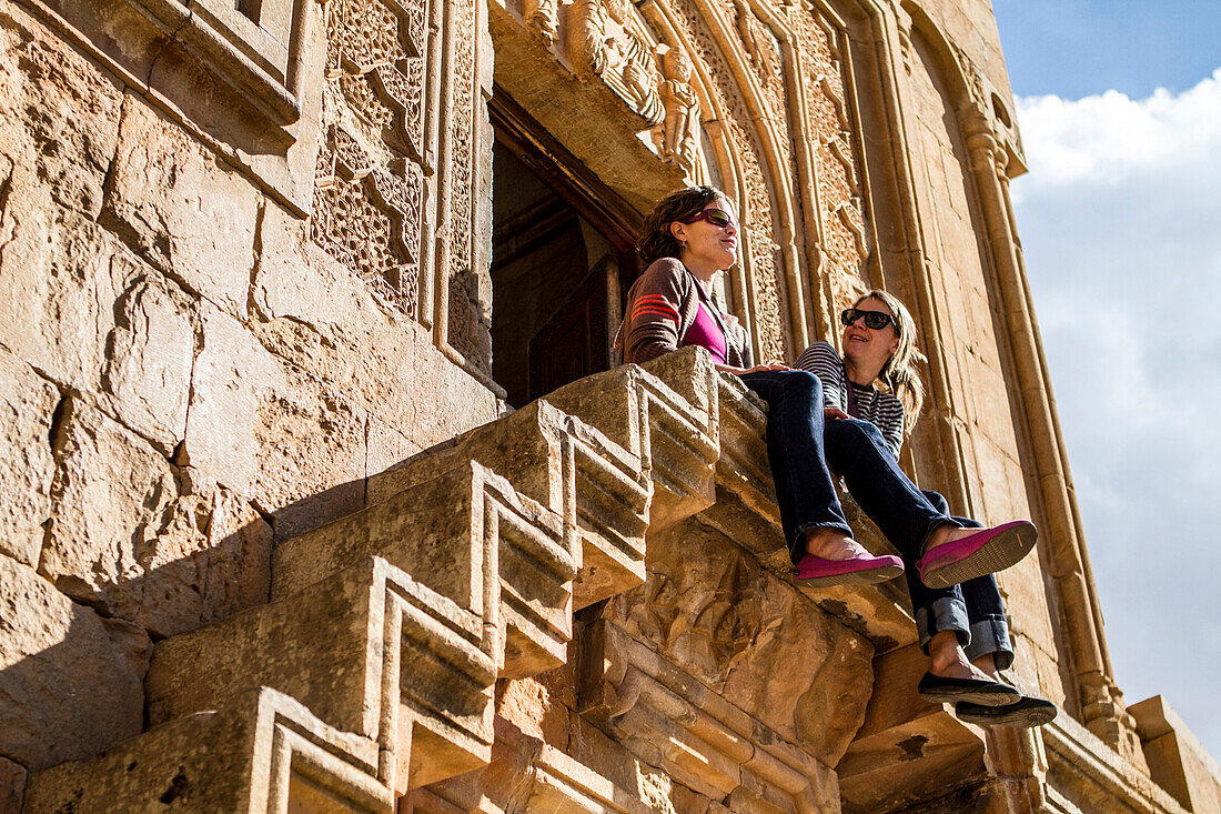 Travelers enjoy the view from Noravank Church, Armenia