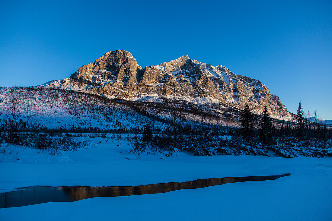 Dalton Highway in wintertime crossing Brooks Range, Yukon-Koyukuk Census Area, Alaska, USA