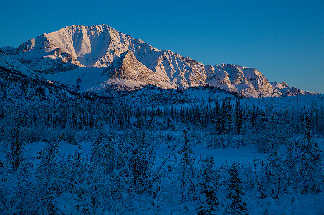 Dalton Highway in wintertime crossing Brooks Range, Yukon-Koyukuk Census Area, Alaska, USA