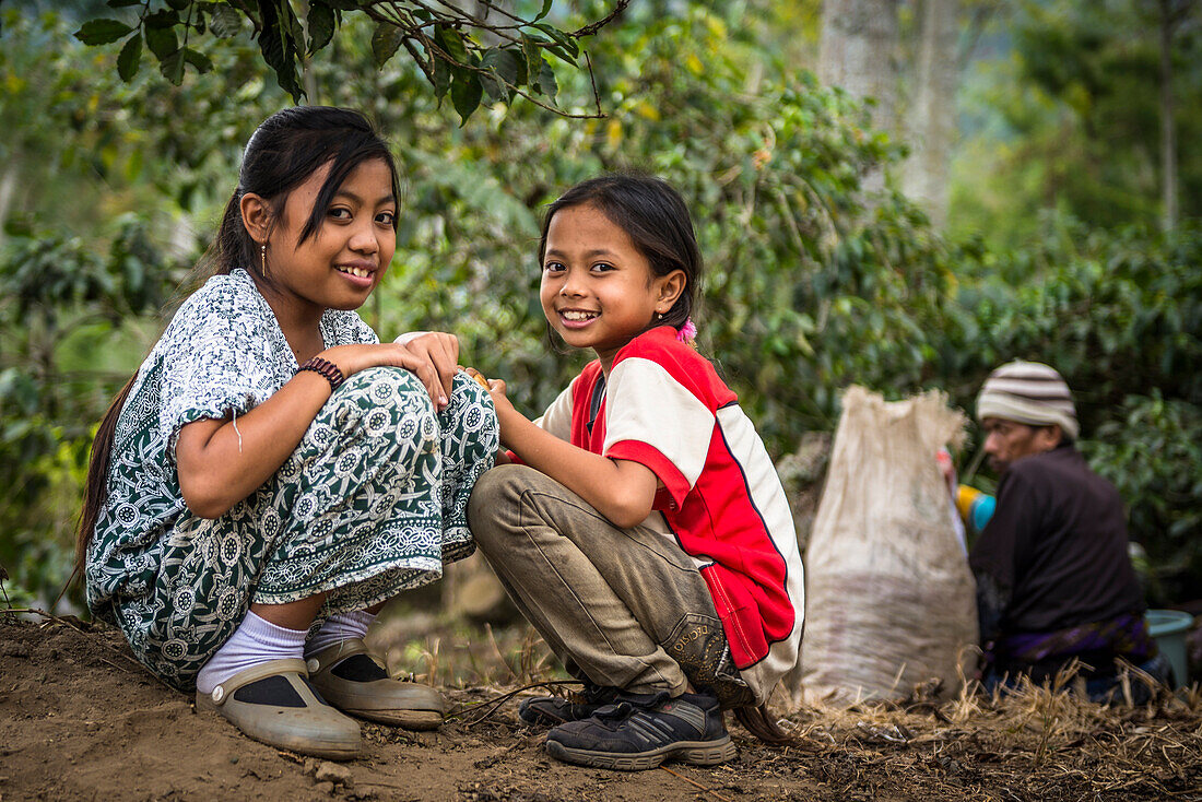 Smiling Indonesian children on a coffee plantation - Indonesia, Java