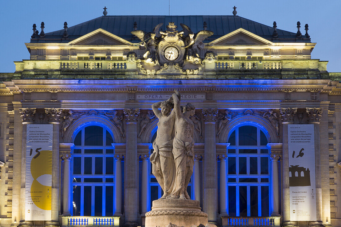 The Three Graces fountain and the Opera in Place de la Comedie in the city of Montpellier at night, Languedoc-Roussillon, France, Europe