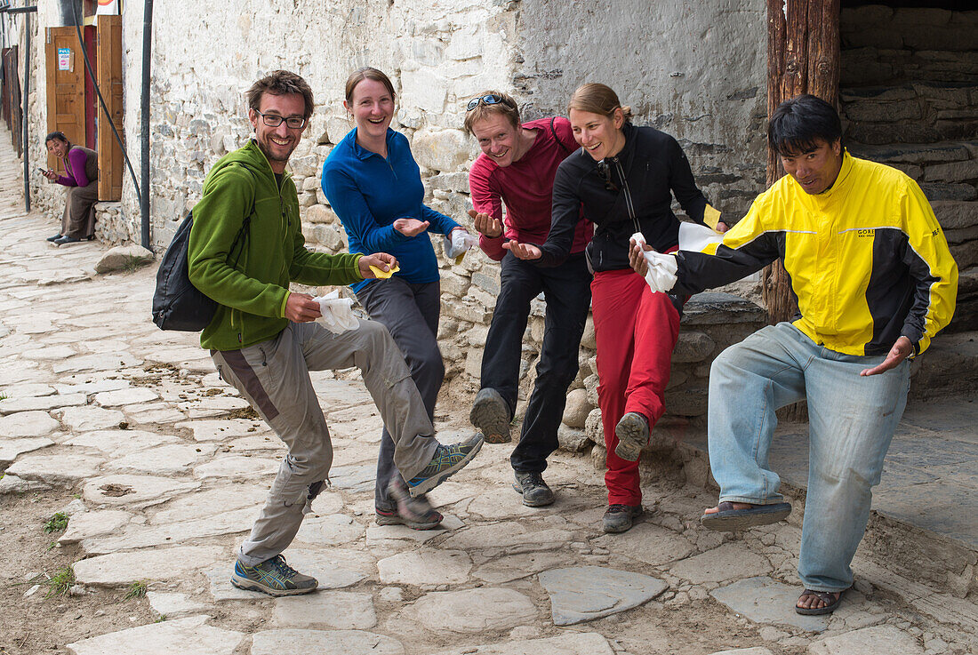 On their way to the King's audience, Hikers, trekkers in front of the King's Palace in Lo Manthang (3840 m), former capital of the Kingdom of Mustang and residence of King Raja Jigme Dorje Palbar Bista in the Kali Gandaki valley, the deepest valley in the