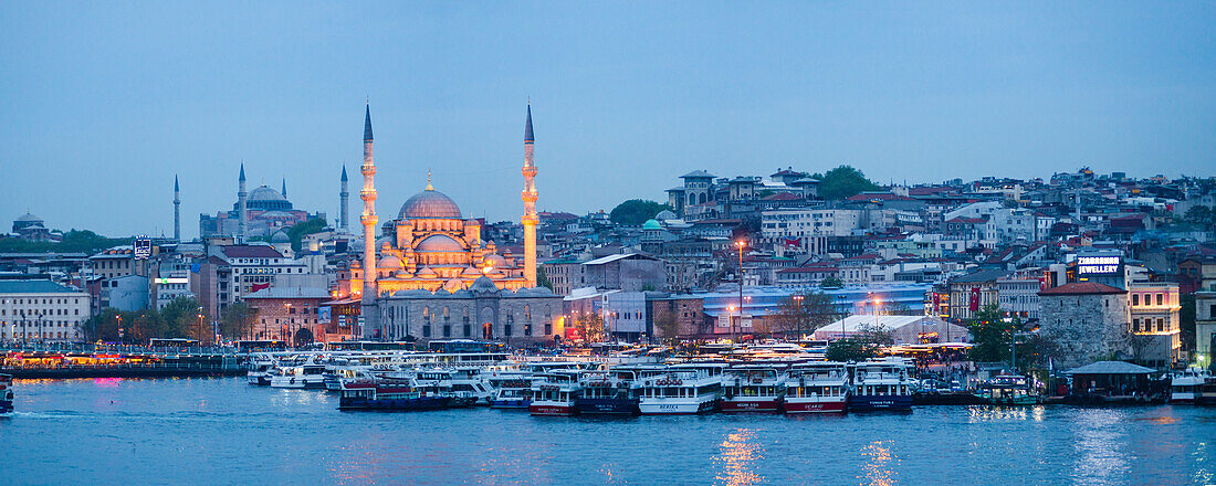 New Mosque Yeni Cami on the banks of the Golden Horn at night with Hagia Sophia Aya Sofya behind, Istanbul, Turkey, Europe