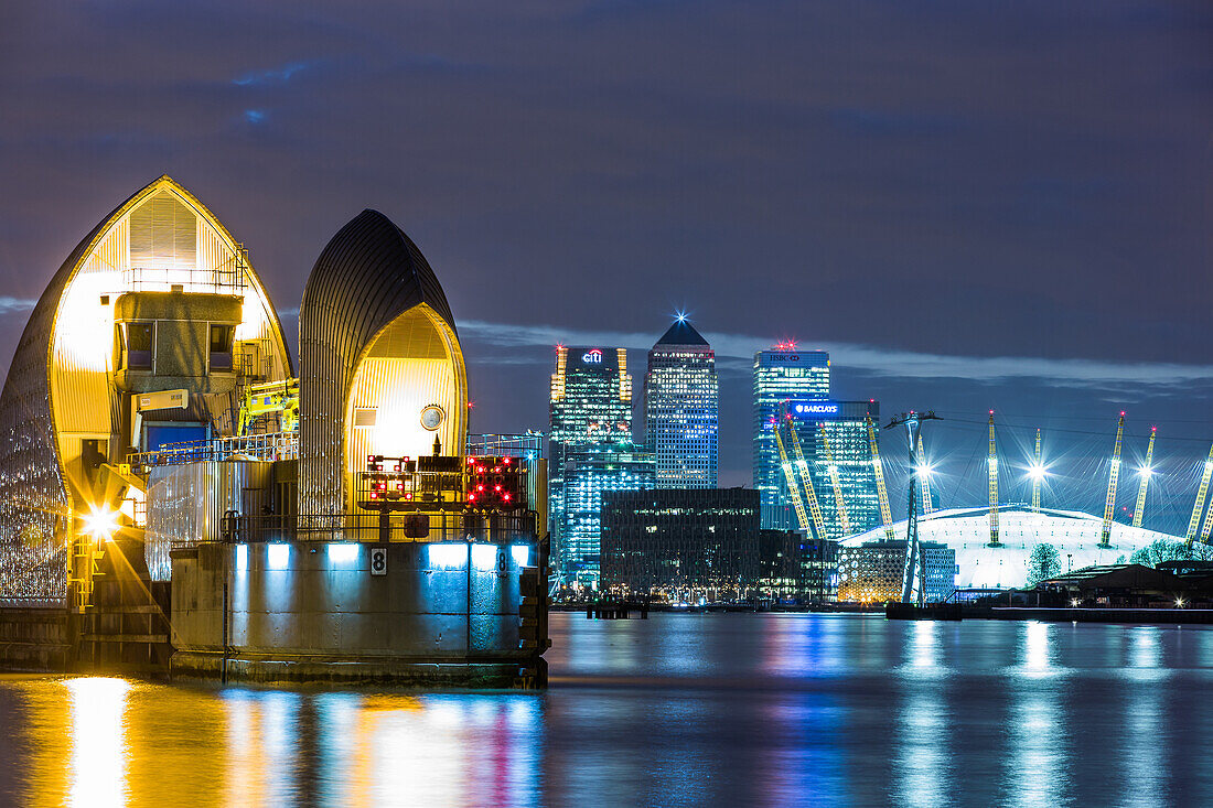 Thames Barrier, Millennium Dome O2 Arena and Canary Wharf at night, London, England, United Kingdom, Europe
