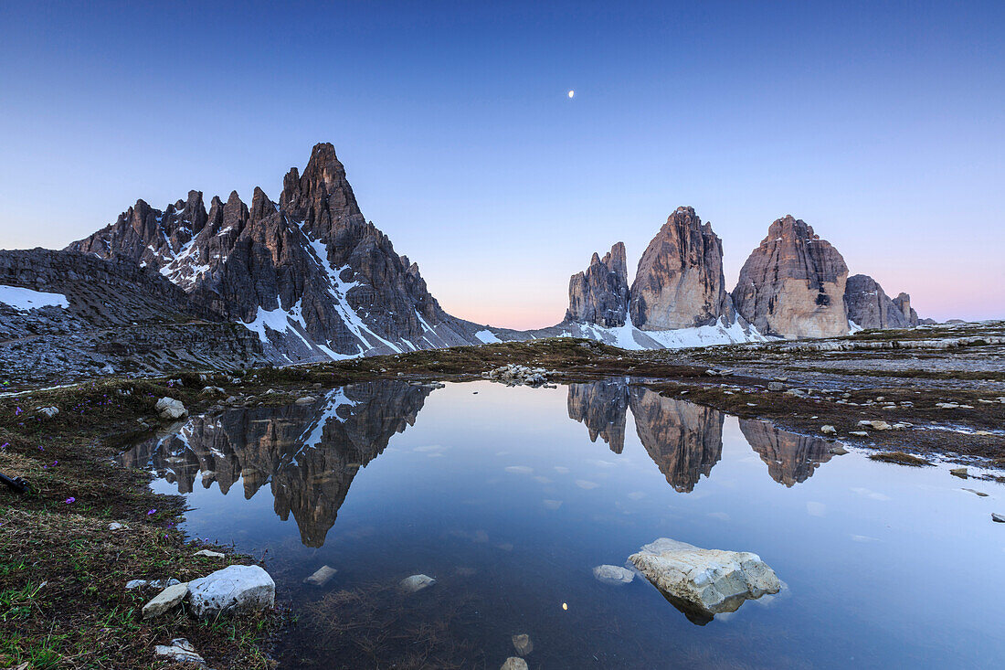 Dawn illuminates the Three Peaks and Mount Paterno  reflected in the lake, Sesto, Dolomites, Trentino-Alto Adige, Italy, Europe