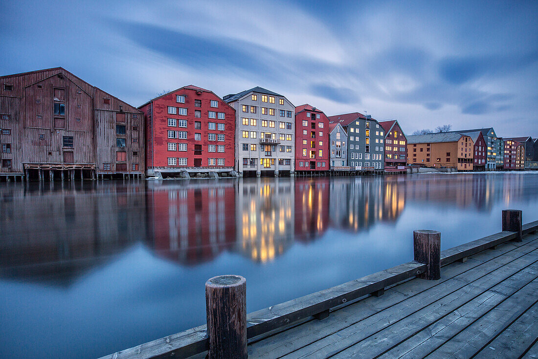 The lights of the houses reflected in the River Nidelva, Bakklandet, Trondheim, Norway, Scandinavia, Europe