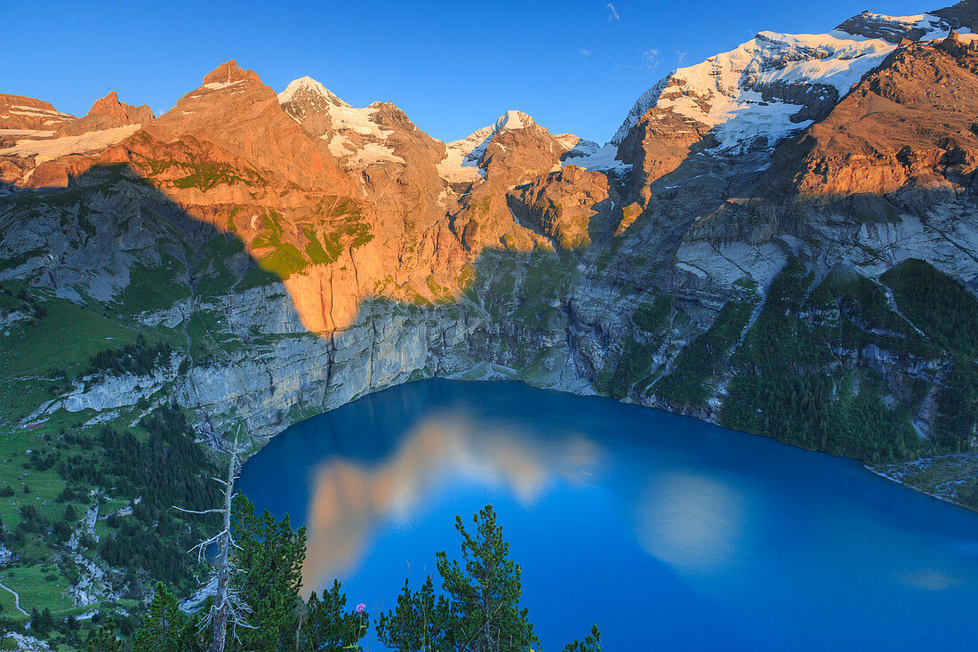 Sunset on Lake Oeschinensee, Bernese Oberland, Kandersteg, Canton of Bern, Switzerland, Europe