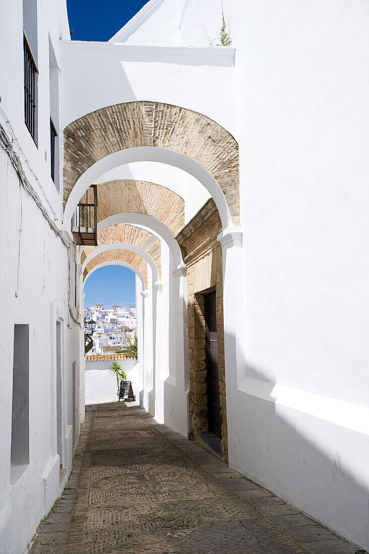 Arched architecture in the narrow lanes of the picturesque village of Vejer de la Frontera, Andalucia, Spain, Europe