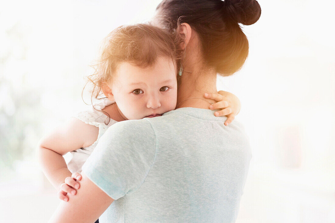 Mother holding baby daughter