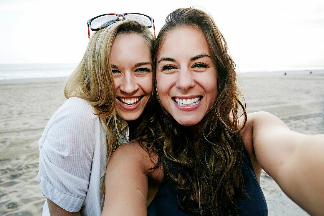Women taking selfie on beach