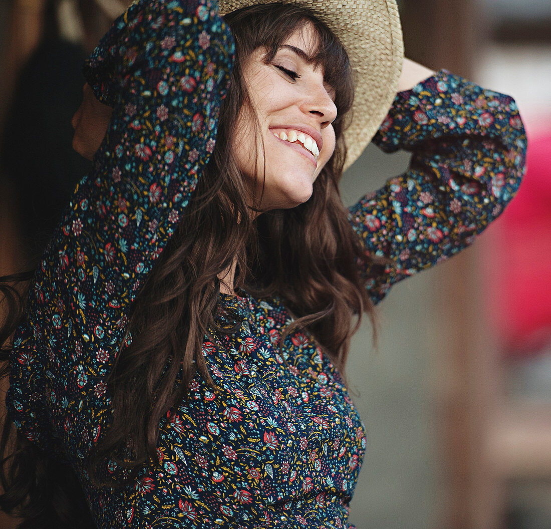 Smiling Caucasian woman dancing outdoors