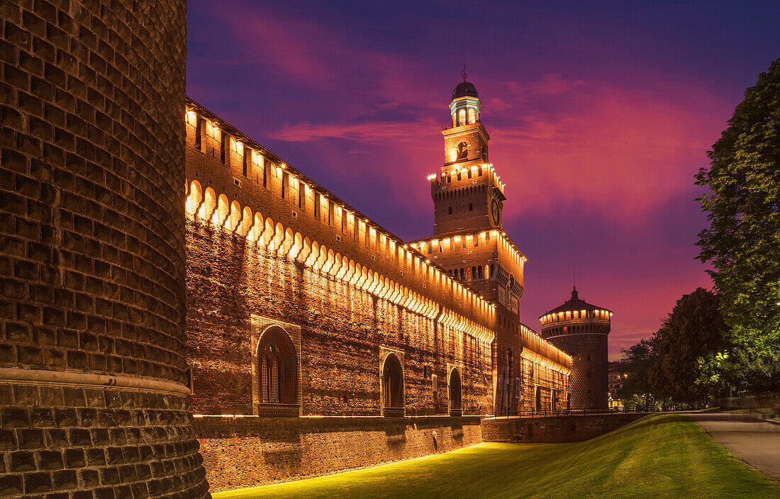 Illuminated tower and castle walls, Milano, Lombardia, Italy