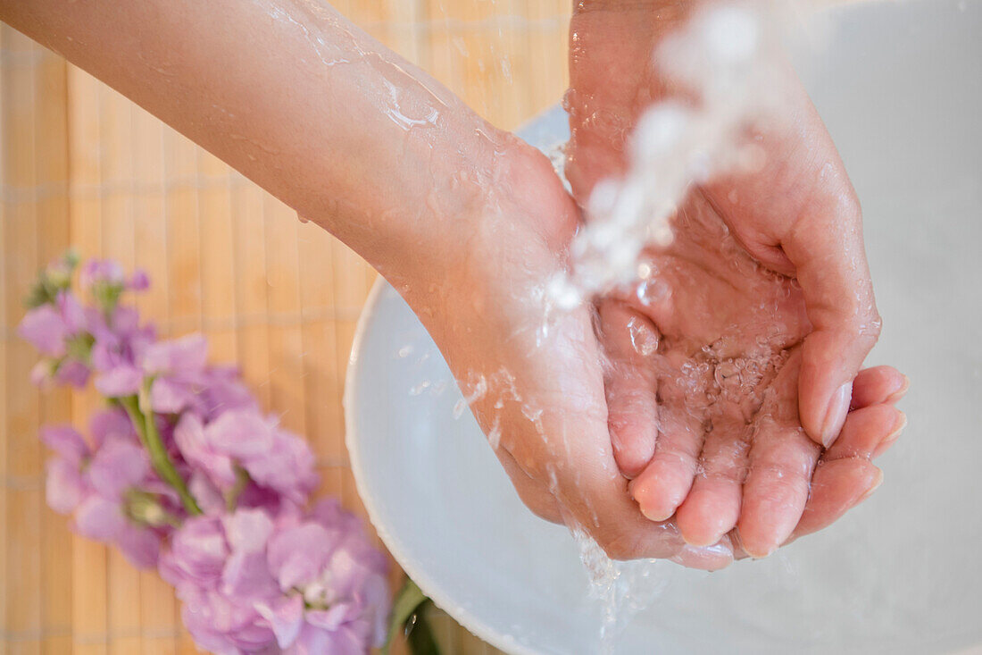 Hispanic woman washing hands