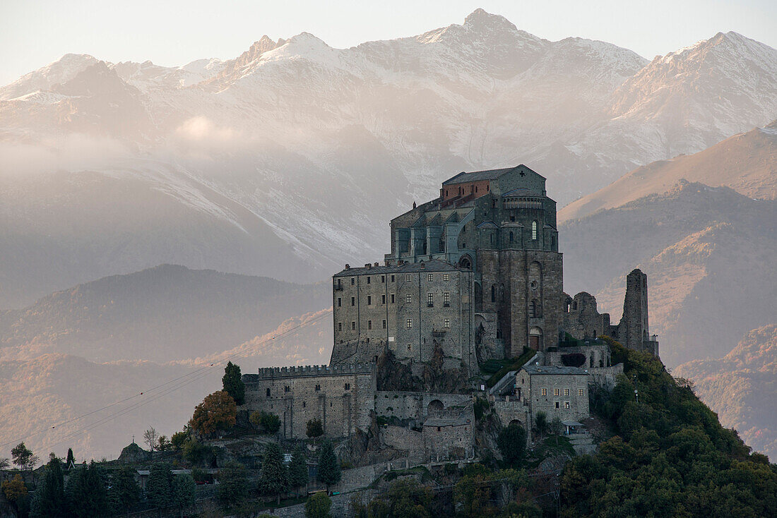 Sacra di San Michele at Sunset with Alps in Background, Italy