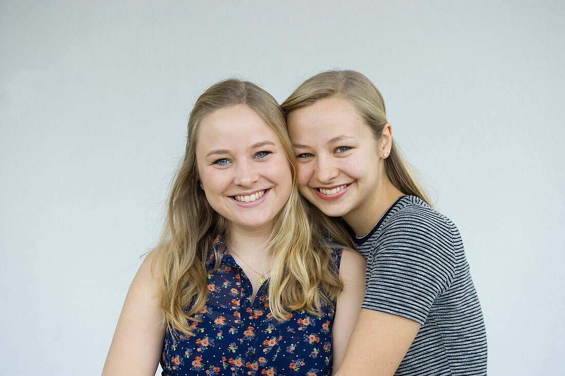 smiling young women, sisters, Germany