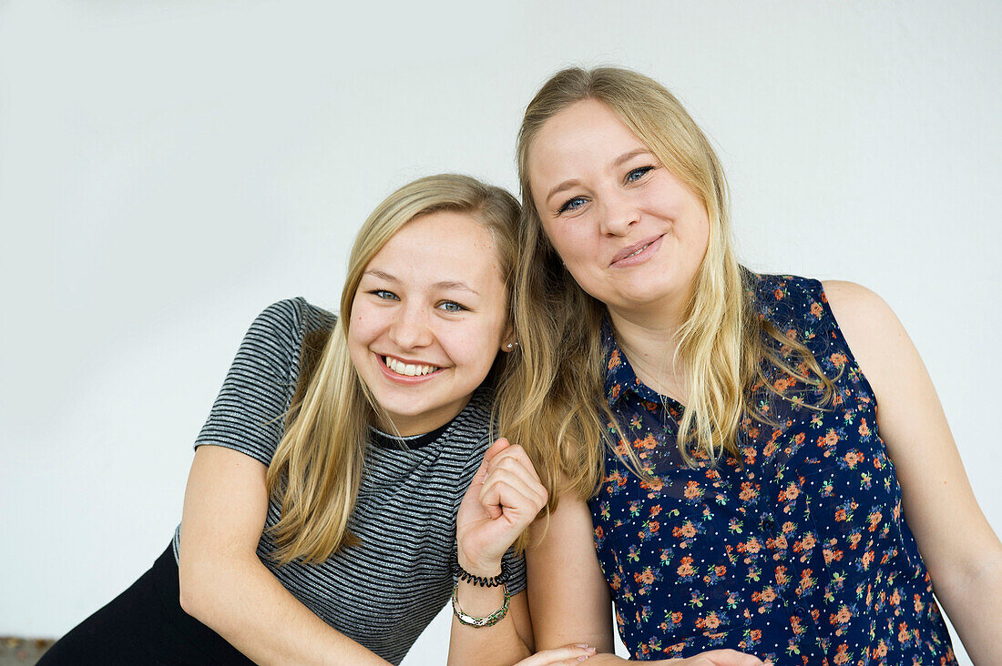 smiling young women, sisters, Germany