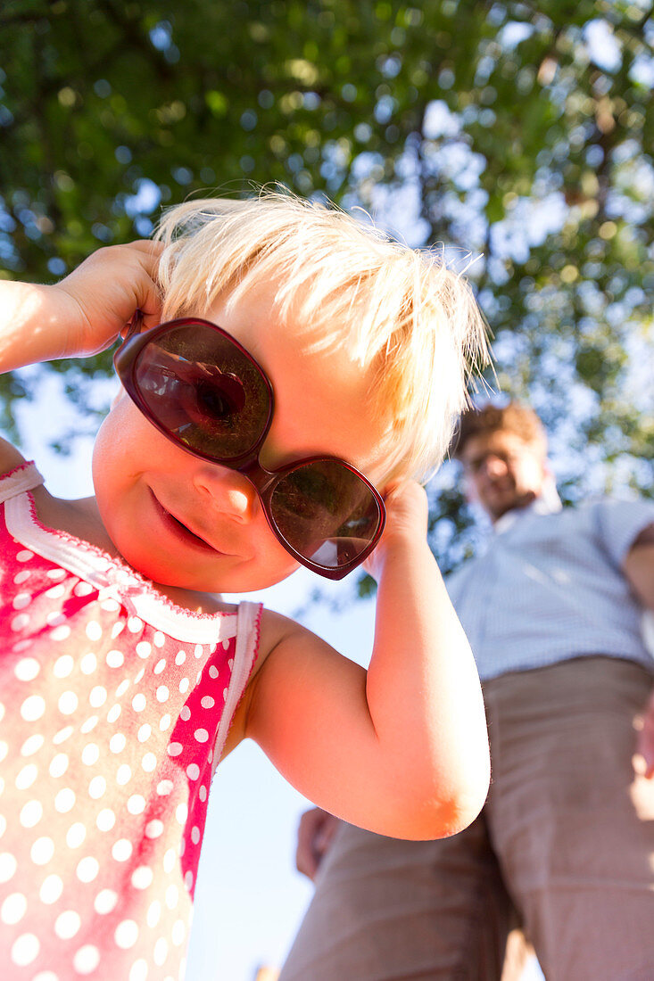 Young girl with her father wearing sunglasses, Baltic sea, MR, Bornholm, Svaneke, Denmark, Europe