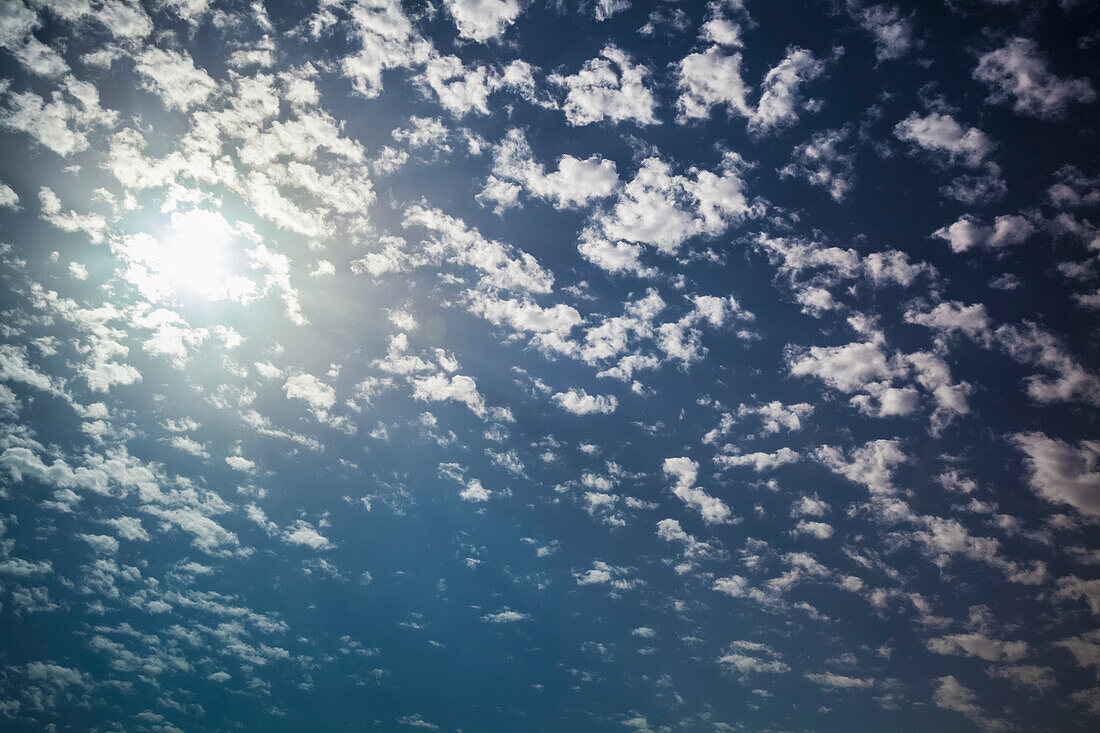 Cloud scattered in a blue sky with sunlight, Israel