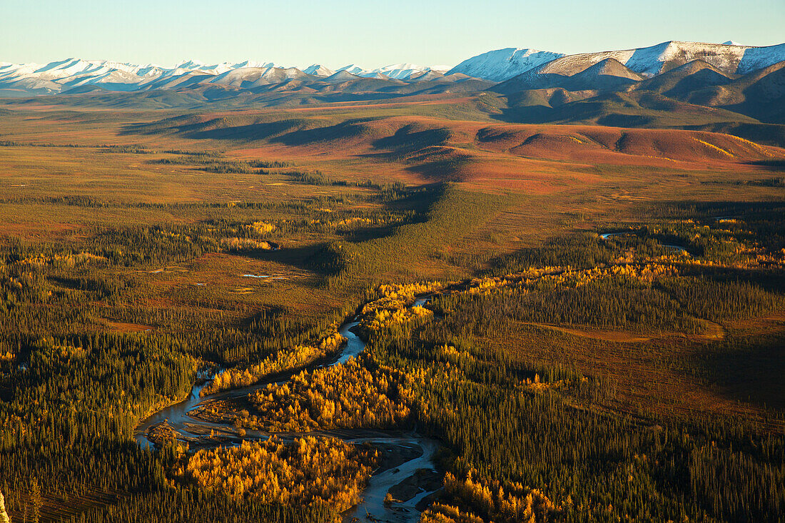 Engineer Creek runs through the landscape along the Dempster Highway as seen from the top of Sapper Hill, Yukon, Canada