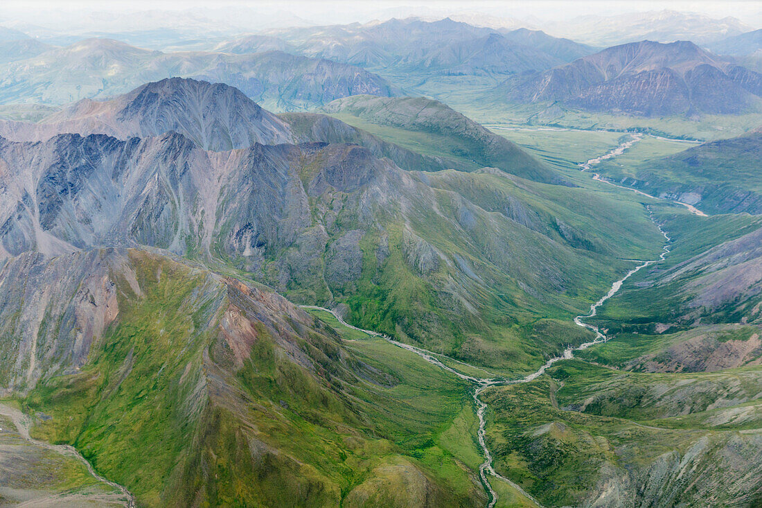 Aerial view of a river cutting through a valley in the Brooks Range, Alaska, United States of America