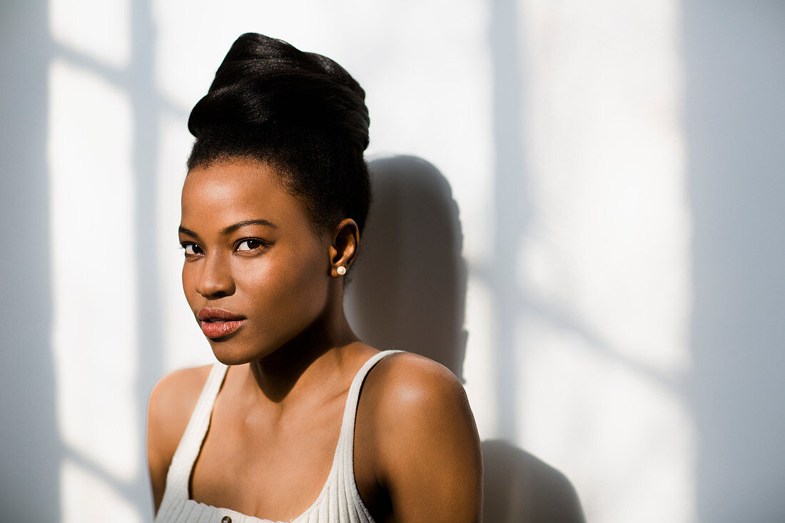 Portrait of an African Canadian woman leaning against a wall, Toronto, Ontario, Canada