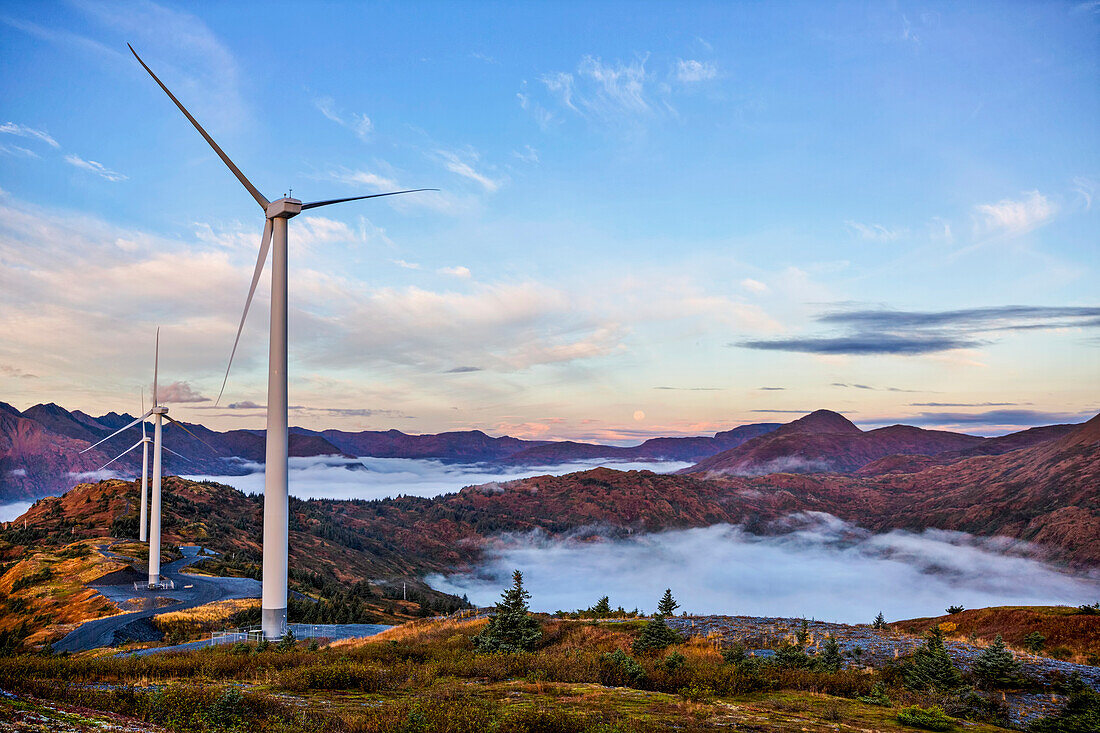 Wind turbines with low fog patches on Pillar Mountain, Kodiak, Alaska, fall