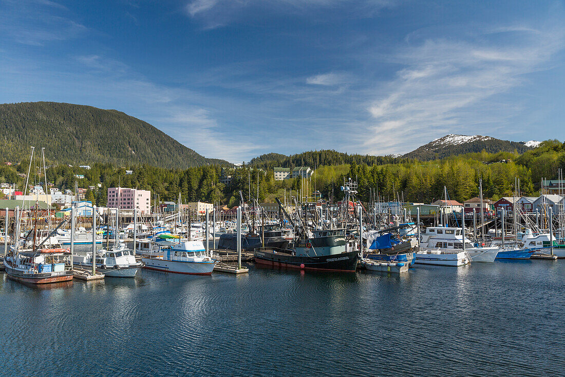 Sailboats and fishing boats docked in Ketchikan's harbor along Creek Street, Southeast Alaska, Spring
