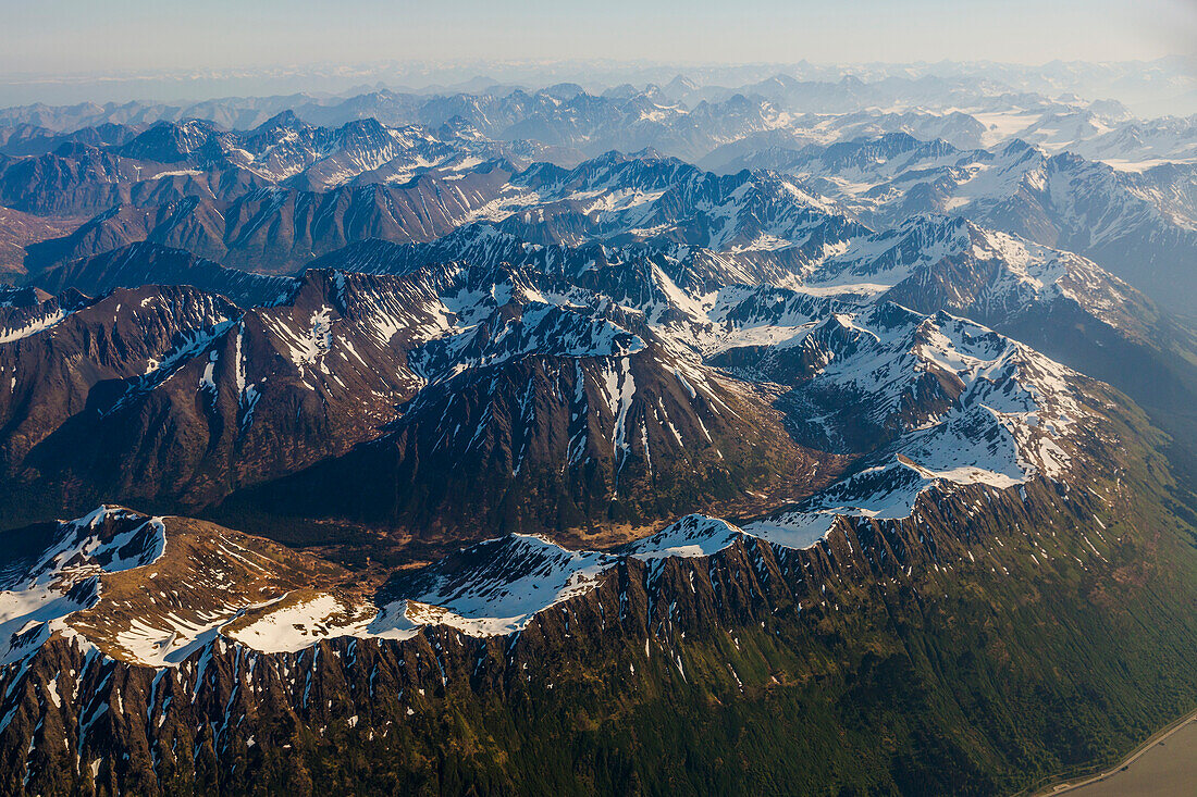 Aerial view of snow covered peaks along the Turnagain Arm in the Chugach Mountains, Southcentral Alaska, USA, Summer