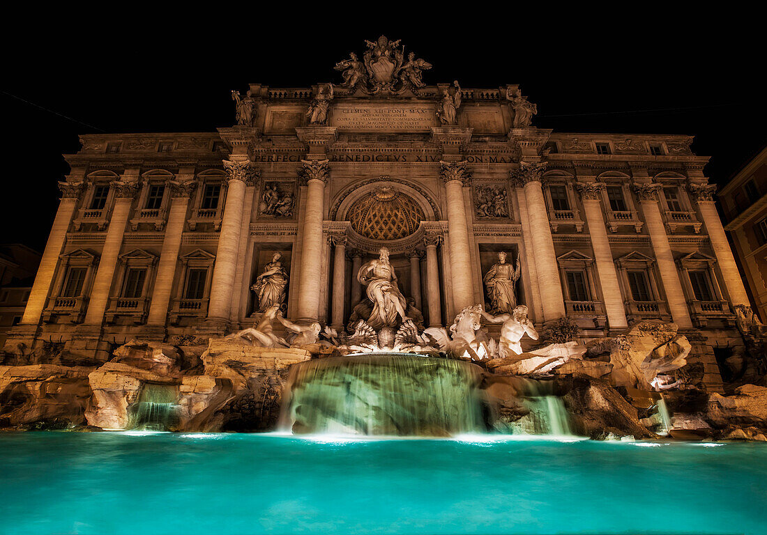 Trevi fountain illuminated at nighttime, Rome, Italy
