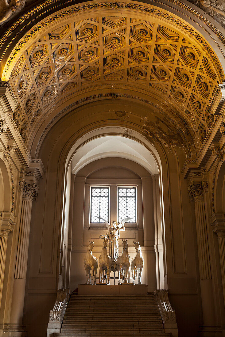 Beautiful sculpture of winged victory with horses inside the Il Vittoriano monument, Rome, Italy