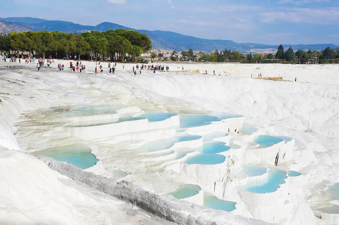 Tourists at the mineral rich pools and hot springs, Pamukkale, Turkey