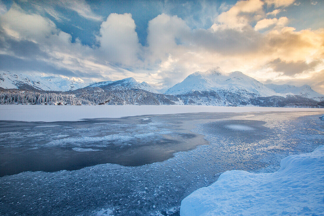 The shore of the frozen Lake Sils, Upper Engadine, Canton of Grisons Graubunden, Switzerland, Europe