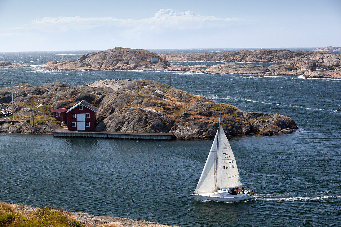 Yacht sailing through islands of archipelago, Skarhamn, Tjorn, Bohuslan Coast, southwest Sweden, Sweden, Scandinavia, Europe