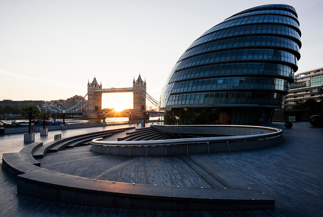 Sunrise behind Tower Bridge and The Mayor's Building City Hall, London, England, United Kingdom, Europe