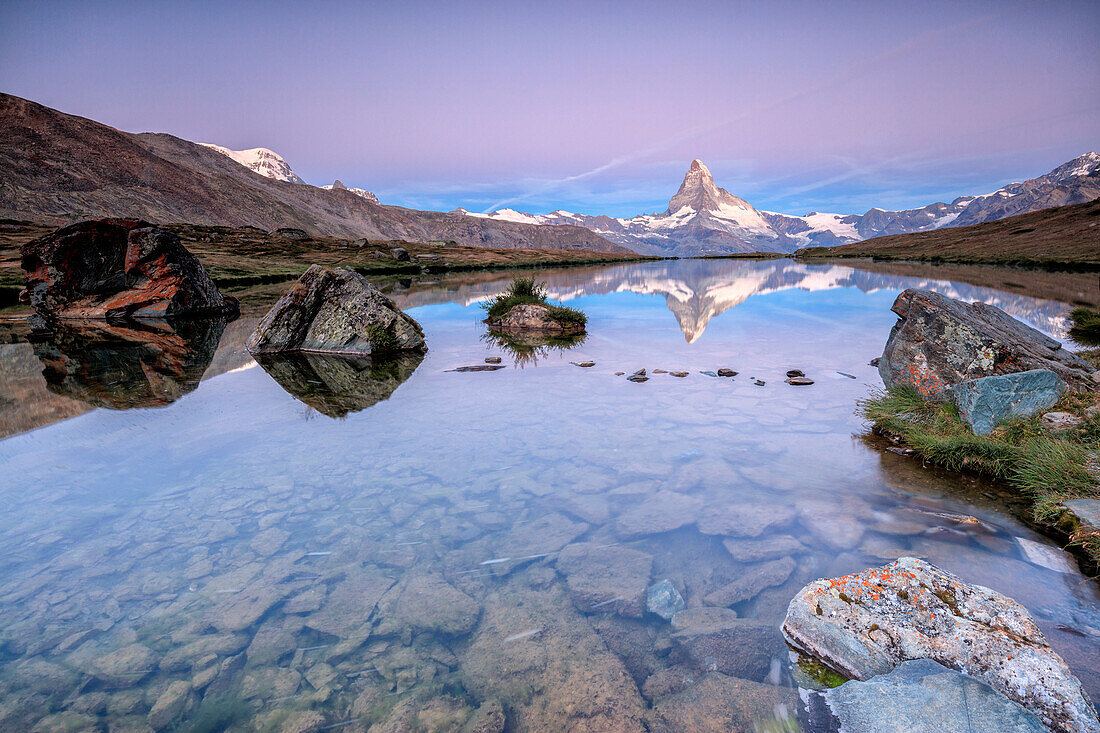 The Matterhorn reflected in Lake Stellisee at dawn, Zermatt, Canton of Valais, Pennine Alps, Swiss Alps, Switzerland, Europe