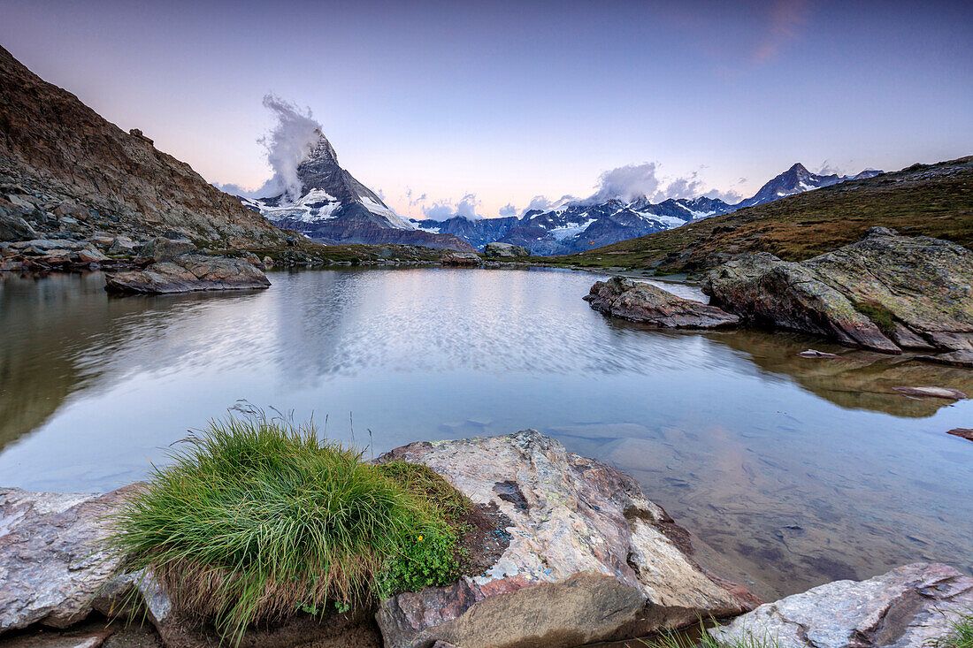 The Matterhorn reflected in Lake Stellisee at dawn, Zermatt, Pennine Alps, Canton of Valais, Swiss Alps, Switzerland, Europe