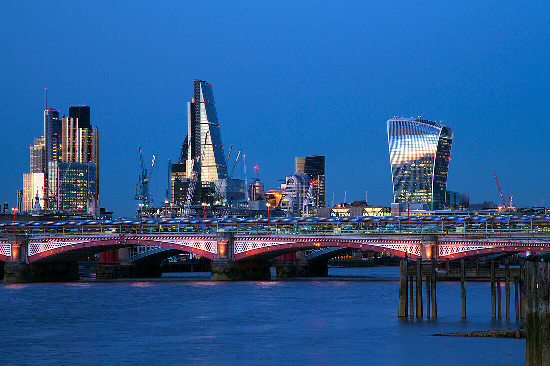 Blackfriars Bridge and River Thames at dusk, taken from South Bank, with Walkie-talkie, Cheesegrater and City of London, London, England, United Kingdom, Europe