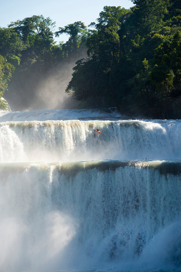 One kayaker dropping a 50 ft waterfall in Cascadas de Agua Azul, Chiapas, Mexico.