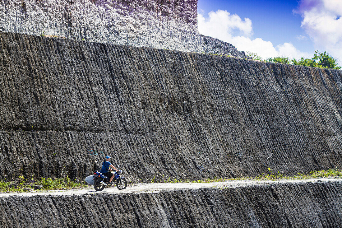 Motorcyclist in mountains.