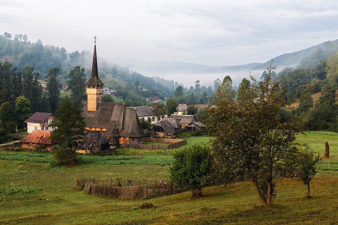 Church in misty rural valley