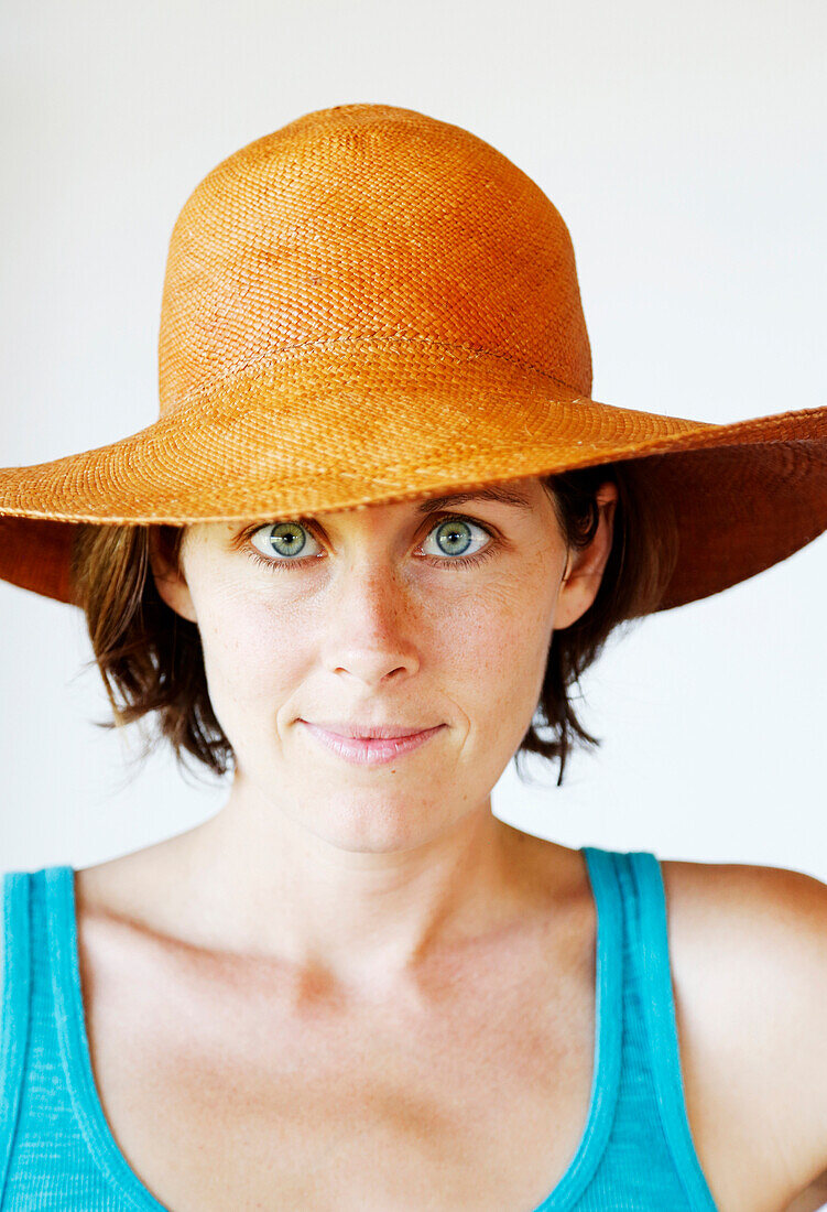 Serious woman wearing sun hat