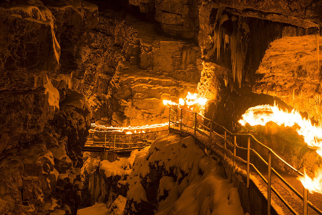 Torchlit hike across the Breitachklamm in Oberstdorf in winter at night, Oberstdorf, Germany