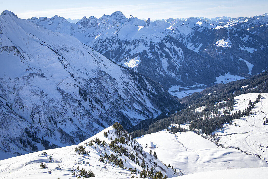 View to the Schwarzwasser valley in winter, sunny and snowy winter landscape, Vorarlberg, Austria