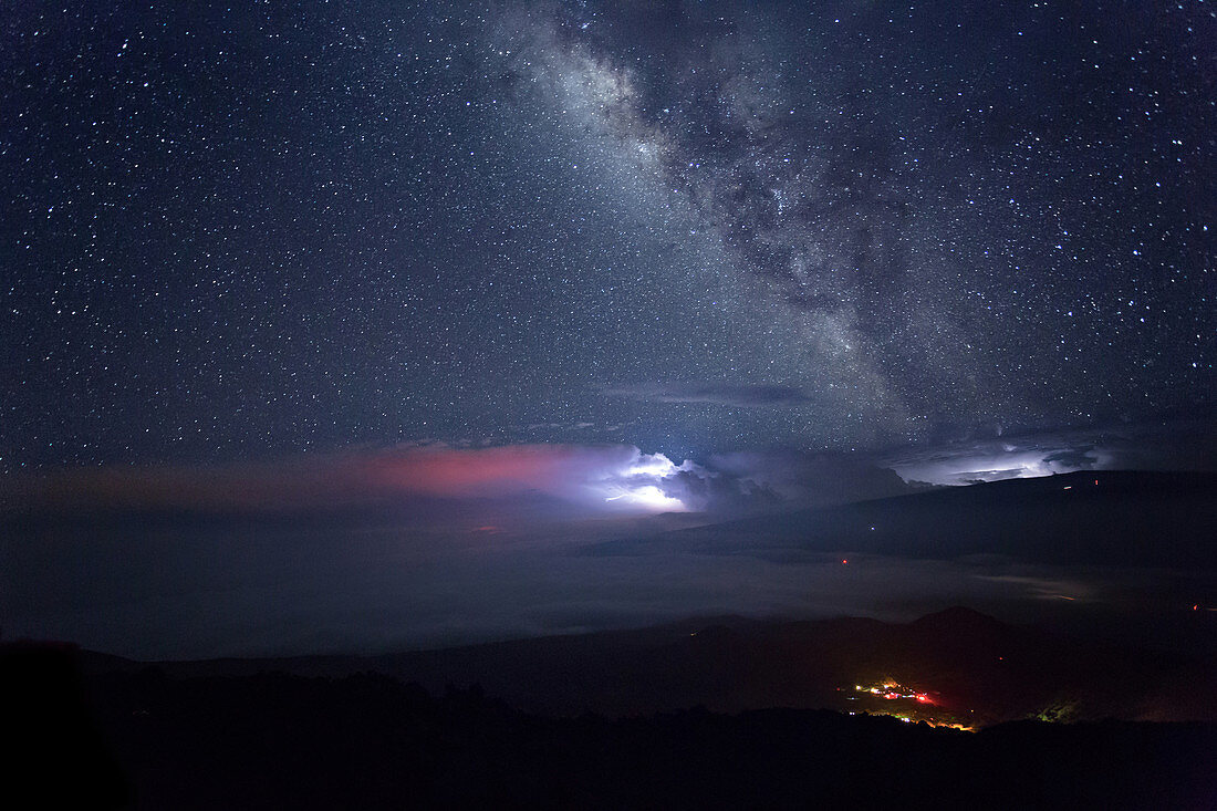 far-off storm, lightning and the milky way seen from the mauna kea observatory, big island, hawaii, united states, usa