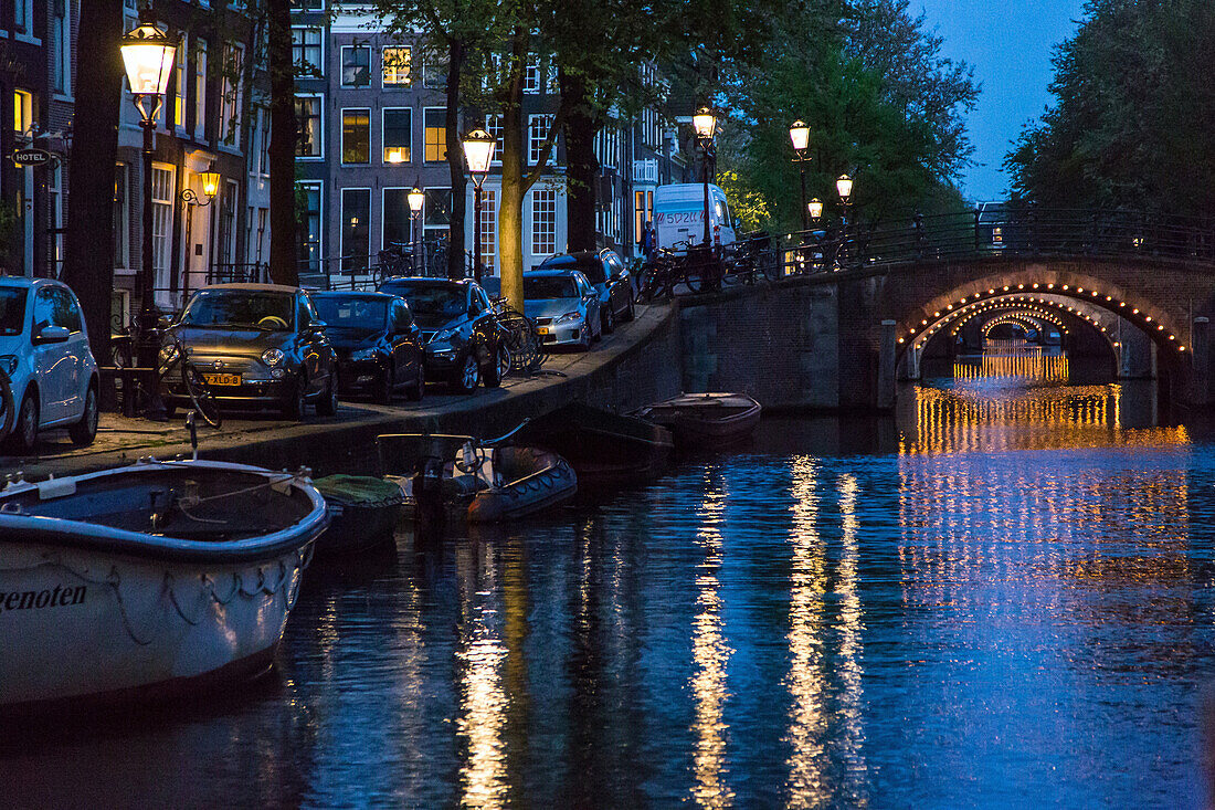 canals lit up at night, amstel, amsterdam, holland