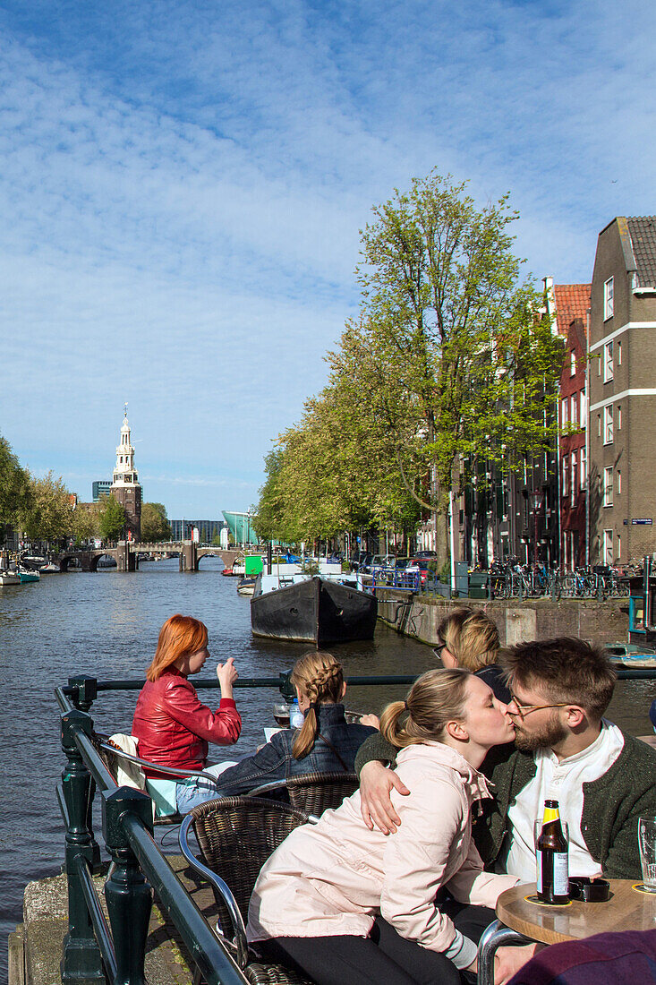 terrace of the sluyswacht cafe dating from 1695, jodenbreestraat, oudeschans canal, amsterdam, holland