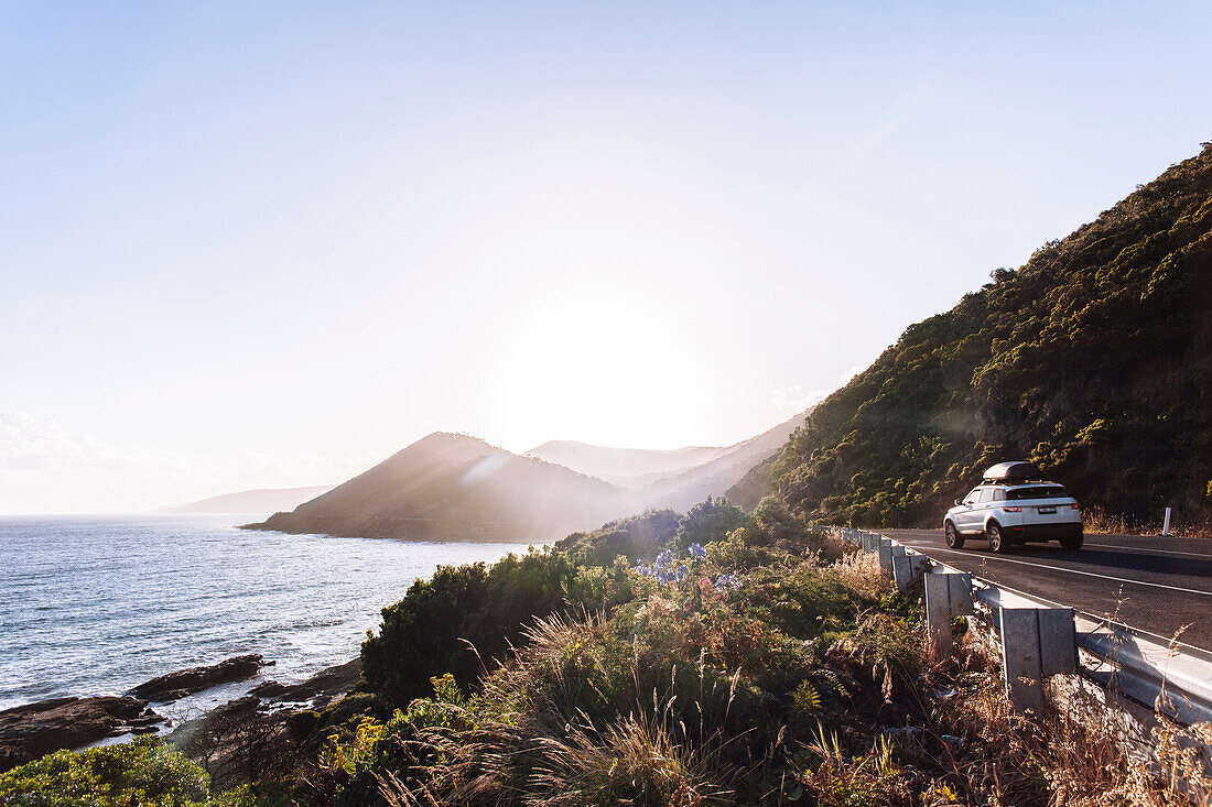 Car driving on coastal road