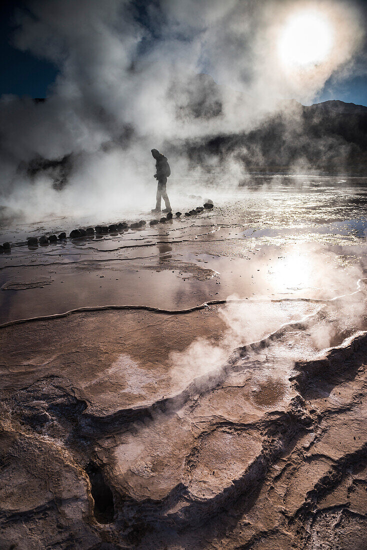 Tourist at El Tatio Geysers Geysers del Tatio, the largest geyser field in the Southern Hemisphere, Atacama Desert, Chile, South America